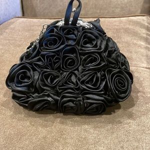 Dollhouse black evening bag with rosettes